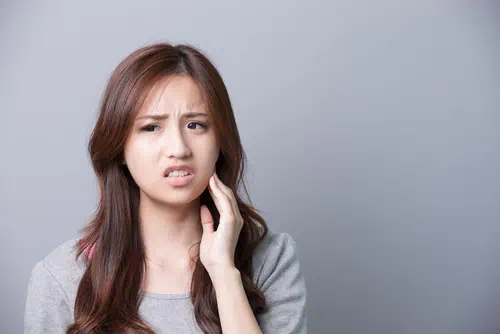 woman with tooth pain