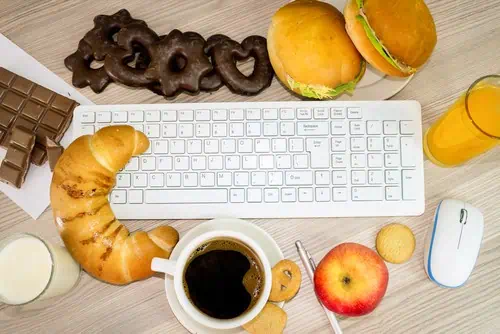 workspace covered in snacks