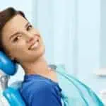 smiling woman in dental chair