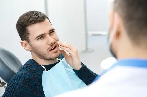 young man with toothache