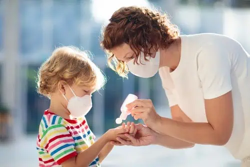 woman and child with facemasks