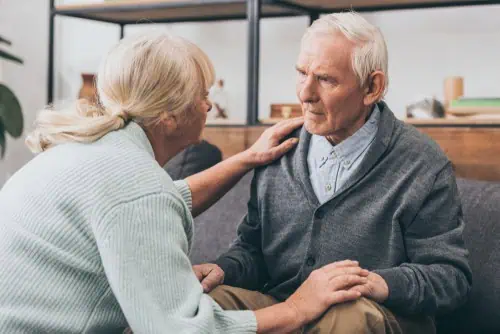 woman comforts man with dementia