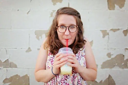 woman drinking with straw