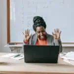 female teacher smiles confidently