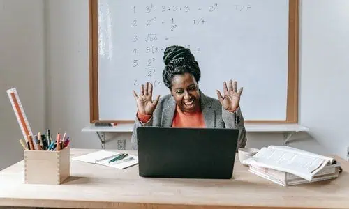 female teacher smiles confidently